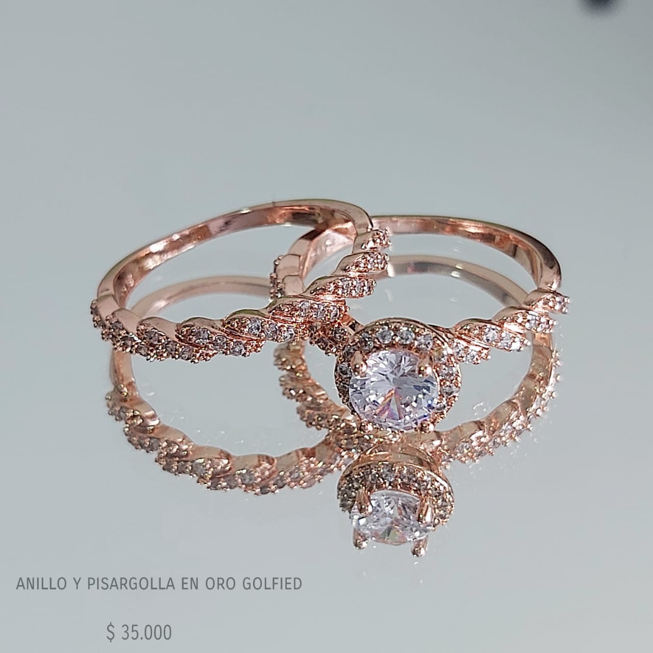 Anillo y pisargolla de oro golfield