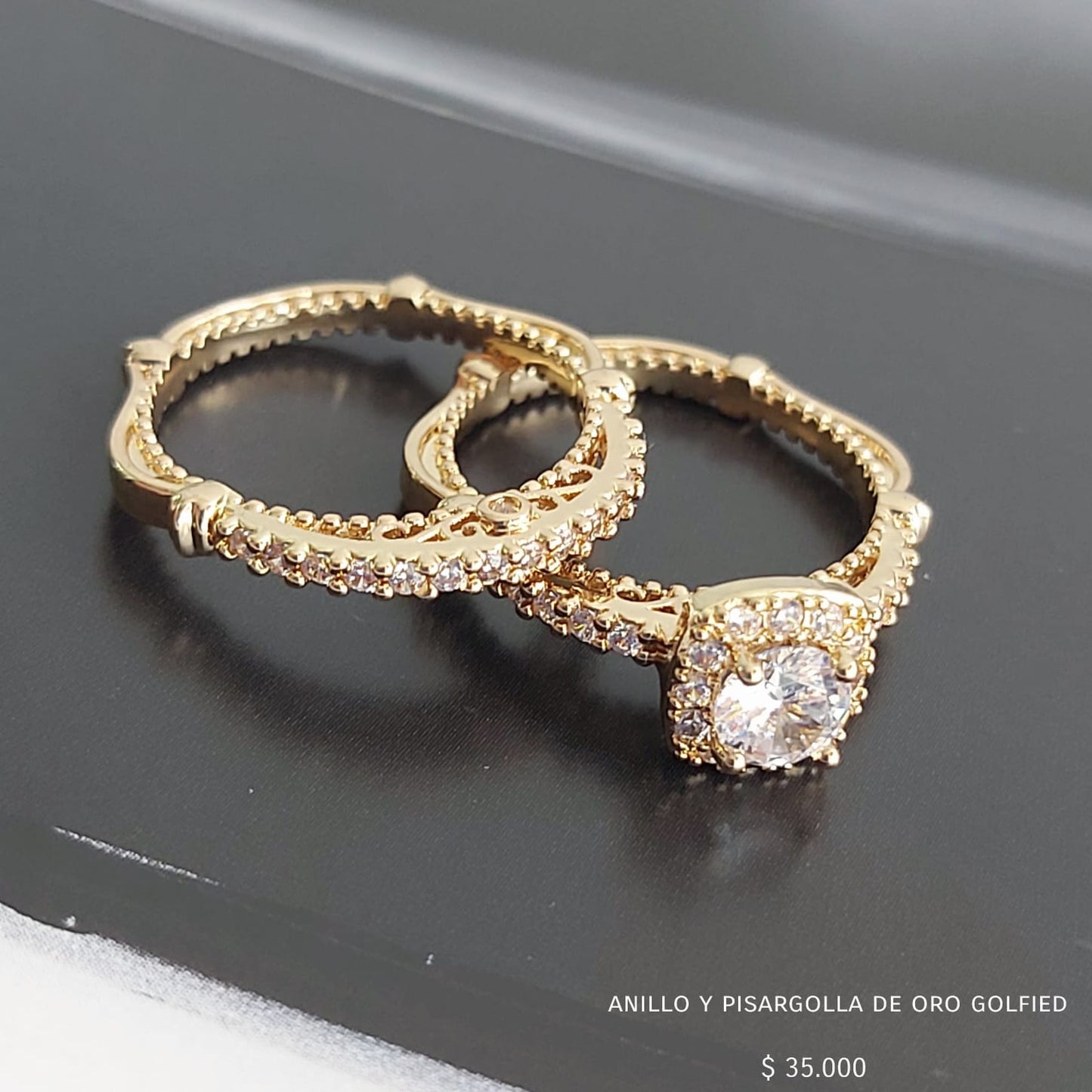 Anillo y pisargolla de oro golfield